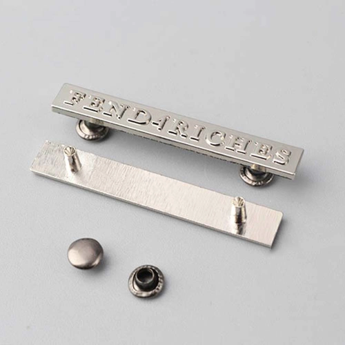 Embossed metal tags for branding